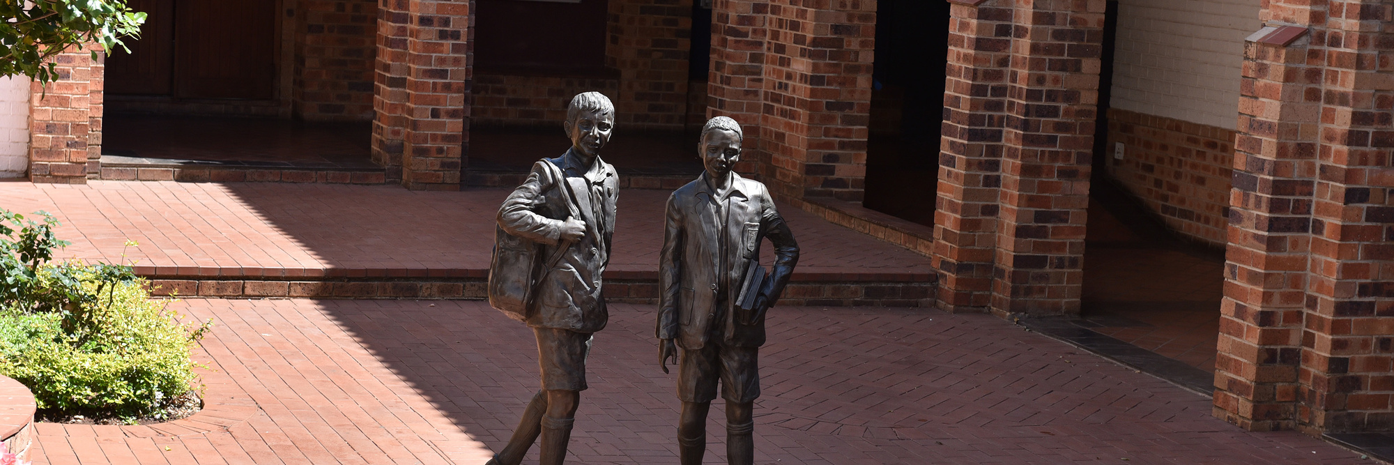 Statue Boys In Courtyard